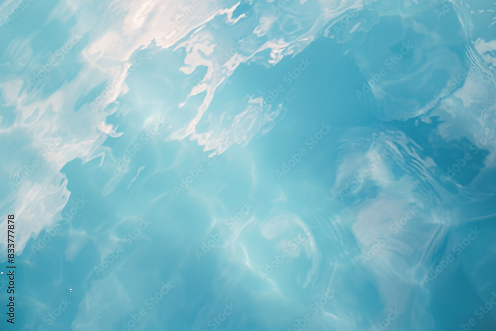 Fototapeta premium Serene blue water surface with gentle ripples and reflections