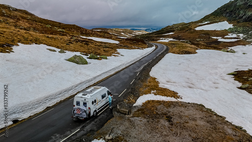 Campervan or motorhome travel camper van, Caravan trailer, or camper RV at the Lyse road covered with snow to Krejag Norway Lysebotn, road covered with snow  photo