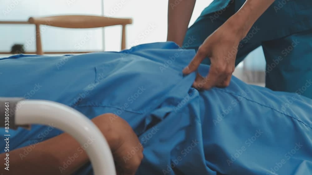 Patient at the physiotherapy doing physical exercises with his therapist Patient at the physiotherapy doing physical exercises with his therapist