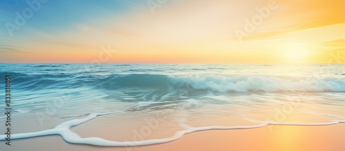 Abstract blur beach with yellow and blue sky sunrise background, ideal for summer holiday concept with copy space image.