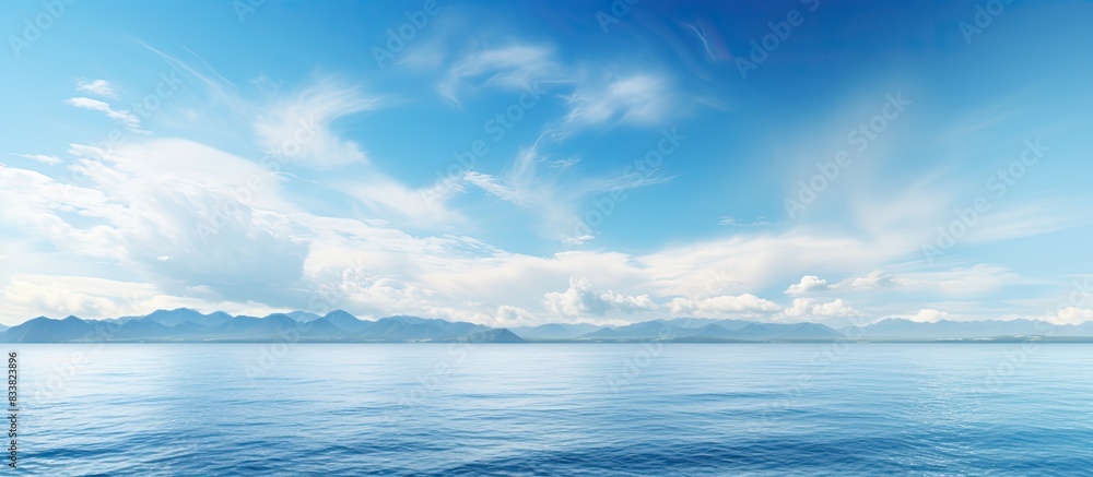 Scenic view of the horizon over the sea with a vast expanse of ocean and sky, providing a tranquil setting for a copy space image. Scenic view of the horizon over the sea with a vast expanse of ocean and sky, providing a tranquil setting for a copy space image.