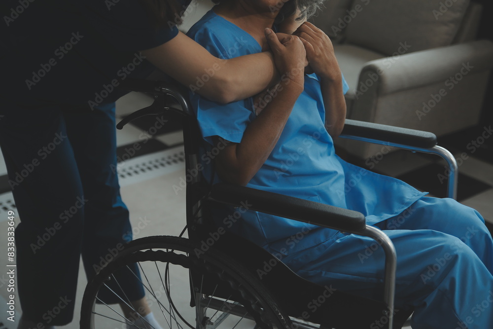 Obraz premium Doctor giving hope. Close up shot of young female physician leaning forward to smiling elderly lady patient holding her hand in palms. Woman caretaker in white coat supporting encouraging old person
