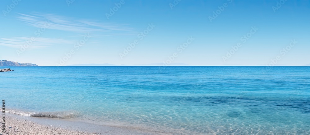 Tranquil seaside scene with a clear blue sky and ample copy space image. Tranquil seaside scene with a clear blue sky and ample copy space image.