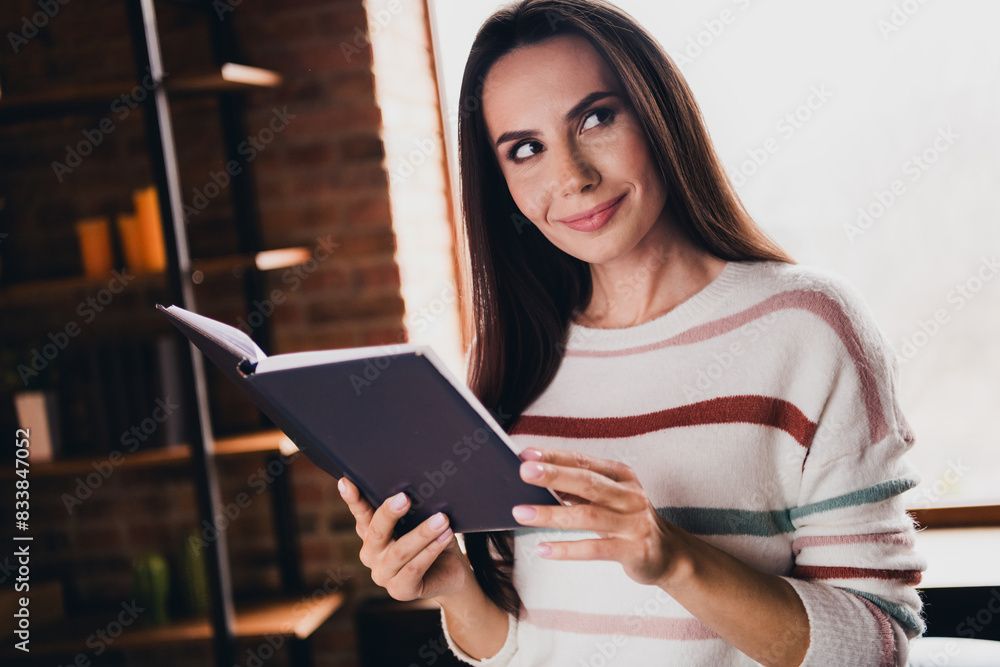 Obraz premium Photo of lovely young woman hold notebook daily routine look empty space wear striped outfit interior home living room in brown warm color