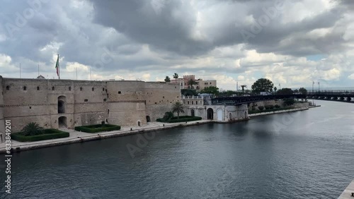 Motion lapse of the swing bridge over the canalboat in Taranto, in the south of Italy on cloudy Sky background 