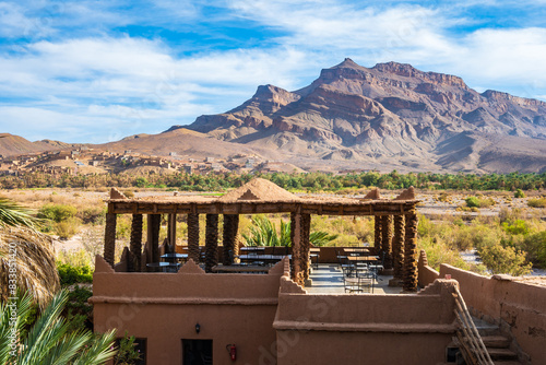 Restaurant building in luxury lodge hotel near Agdz town with view of Jebel Kissane mountain in Atlas Mountains, Morocco, North Africa photo