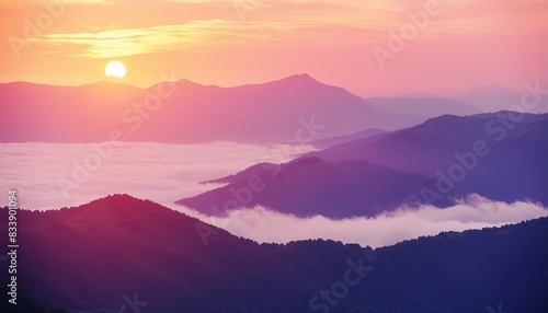 beautiful mountains in the pink foggy sunset abstract nature background