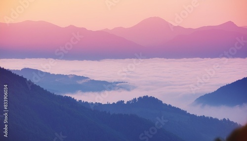 beautiful mountains in the pink foggy sunset abstract nature background