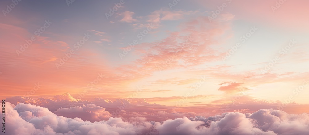 Morning sky at sunrise displaying soft pink clouds with yellow hues, offering a serene backdrop for copy space image. Morning sky at sunrise displaying soft pink clouds with yellow hues, offering a serene backdrop for copy space image.