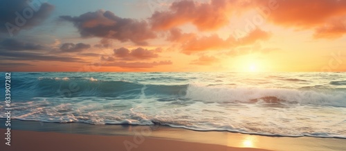 Sunset on the beach shore with a captivating view and ample copy space image available.