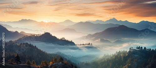 Mountain sunrise with mist ...