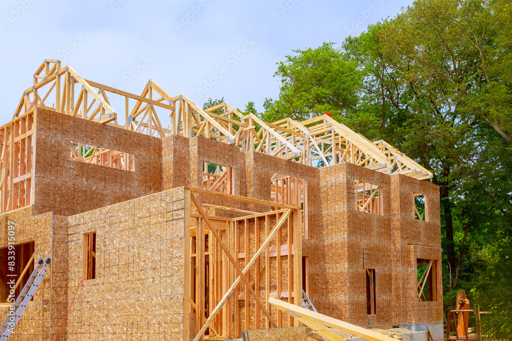 Unfinished interior of newly built house with wooden stud timber framing Unfinished interior of newly built house with wooden stud timber framing