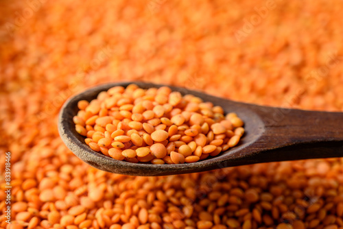 Red lentils and wooden spoon