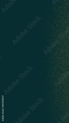 Gold tiny dots glitter on emerald green background on the right side of the frame. Vertical abstract stars backdrop party or Christmas holidays and New Year concept with copy space