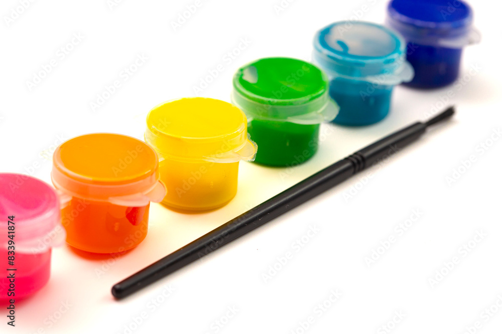 A Set of Childrens Rainbow Paint Isolated on a White Background A Set of Childrens Rainbow Paint Isolated on a White Background