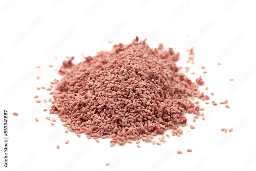 A Pile of Dried Red Raspberry Seeds Isolated on a White Background A Pile of Dried Red Raspberry Seeds Isolated on a White Background