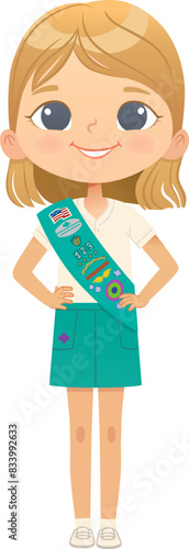 Young smiling blond girl scout wearing sash with badges isolated on white background. Female scouter, Junior ligue Scout Girls troop