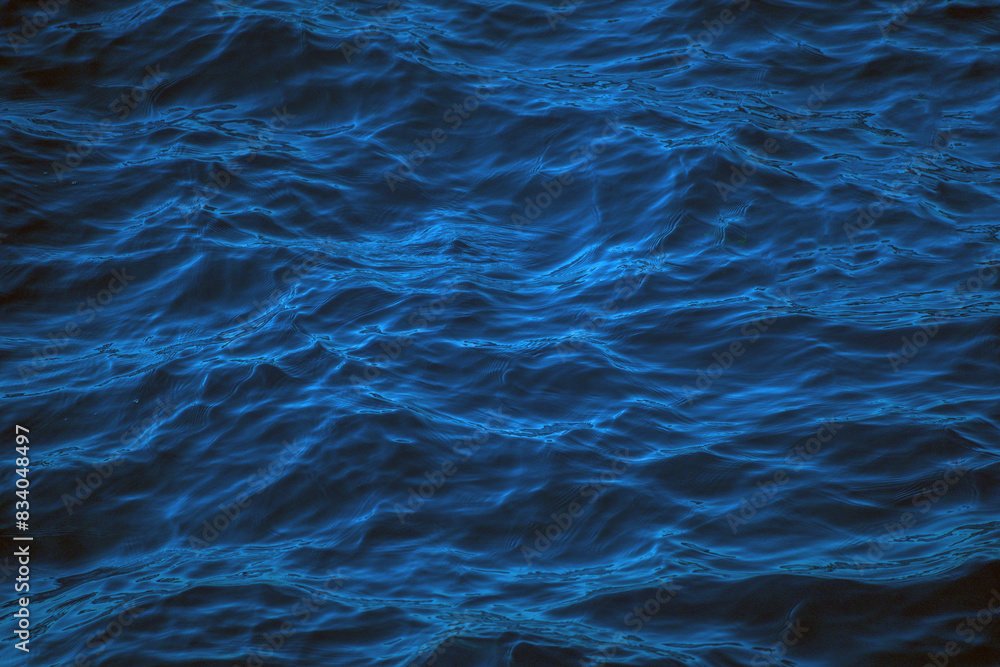 An abstract background of seawater flow under light exposure