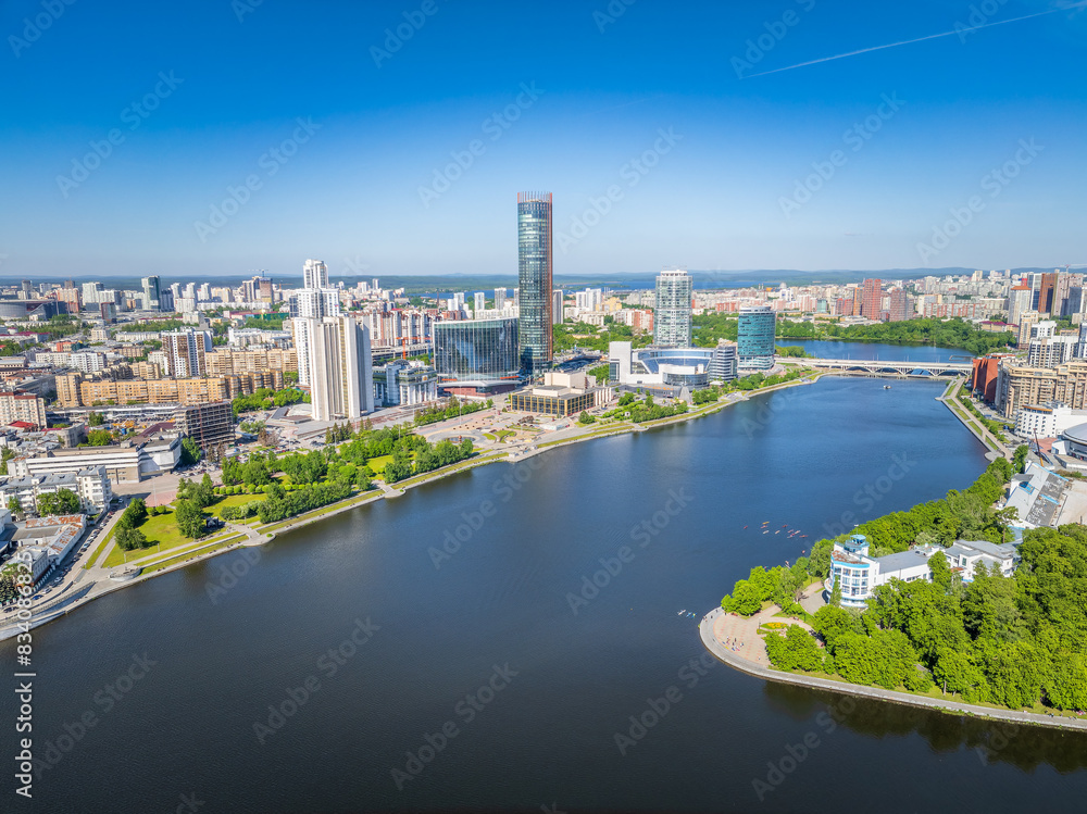 Fototapeta premium Yekaterinburg city with Buildings of Regional Government and Parliament, Dramatic Theatre, Iset Tower, Yeltsin Center, panoramic view at summer sunset.