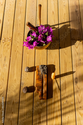 Tibetan Sound Bowl and Healing Instruments on Wooden Background photo