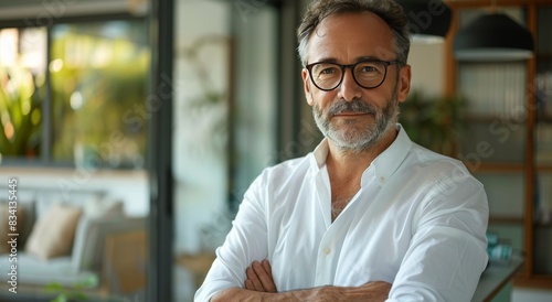 Mature Man Wearing Glasses and White Shirt Indoors During Daytime