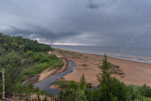 Fototapeta Naklejka Na Ścianę i Meble -  View to the baltic sea and Incupe river from Saulkrasti white dune, Latvia on rainy day