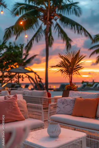 Sunset landscape of an oceanfront beach club with modern furniture
