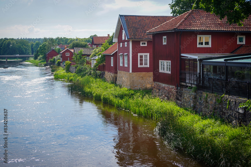 Buildings by a river during summer Buildings by a river during summer