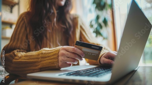 A young woman making credit...