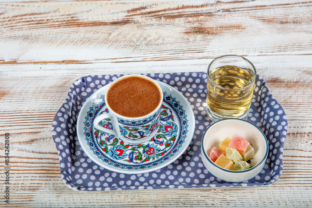 Ottoman Tile Motif Turkish Coffee Cup and Colorful Turkish Delights, Ramadan Kareem Concept Photo. Turkish coffee on a colorful background. Ottoman Tile Motif Turkish Coffee Cup and Colorful Turkish Delights, Ramadan Kareem Concept Photo. Turkish coffee on a colorful background.