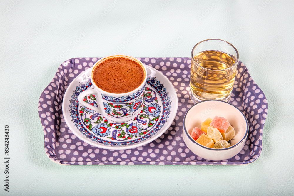 Ottoman Tile Motif Turkish Coffee Cup and Colorful Turkish Delights, Ramadan Kareem Concept Photo. Turkish coffee on a colorful background. Ottoman Tile Motif Turkish Coffee Cup and Colorful Turkish Delights, Ramadan Kareem Concept Photo. Turkish coffee on a colorful background.