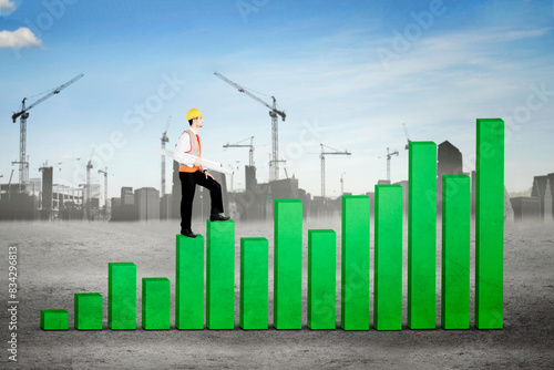 Construction Workers Climb Green Bar Graph in construction site background