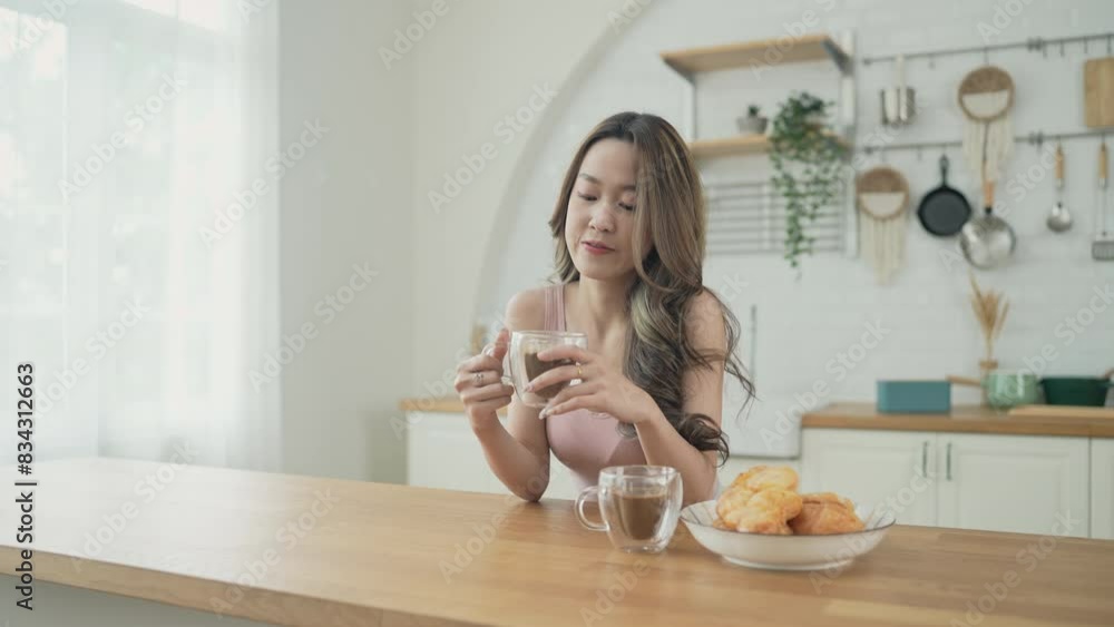 Holiday concept of 4k Resolution. Asian women having coffee together in the kitchen. Young women are in a mutual lesbian love relationship. Holiday concept of 4k Resolution. Asian women having coffee together in the kitchen. Young women are in a mutual lesbian love relationship.