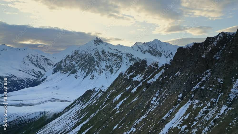 high relief mountains covered with snow, mountain range, aerial view drone shot