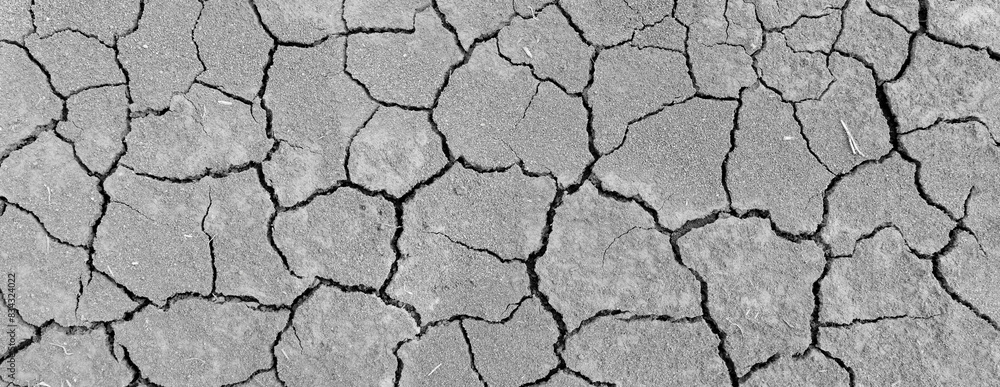 Wall texture soil dry crack pattern of drought lack of water of nature brown old broken background.