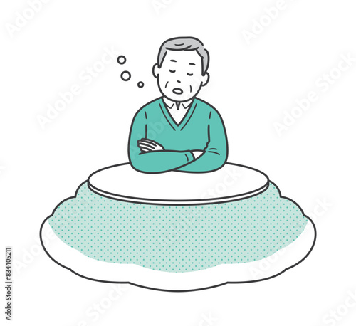 こたつに入って居眠りをする高齢男性