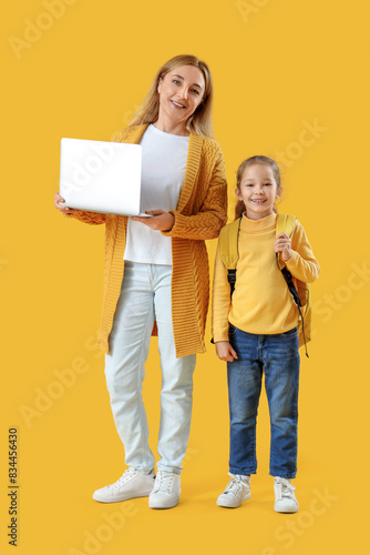 Little schoolgirl and her g...