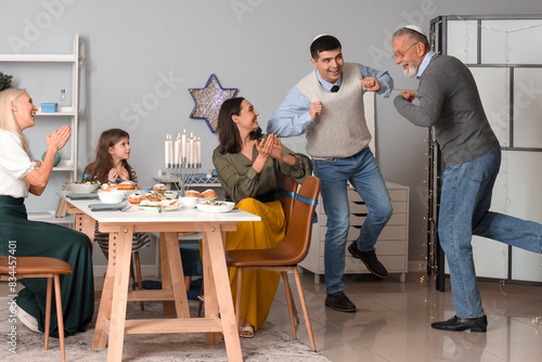 Happy family celebrating Hanukkah at home