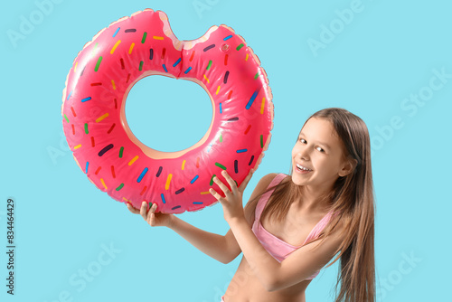 Cute little girl in swimsui...