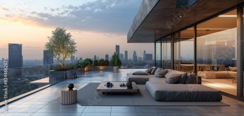 Modern rooftop patio with city skyline view at sunset, featuring stylish outdoor furniture and large glass windows.
