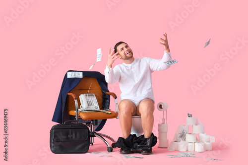 Happy businessman on toilet...