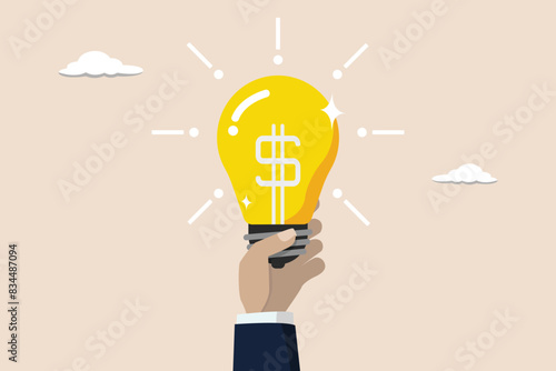 Enlighten money idea, business idea to make money or profit, innovation concept, businessman hand hold brightly lit money dollar lightbulb idea.