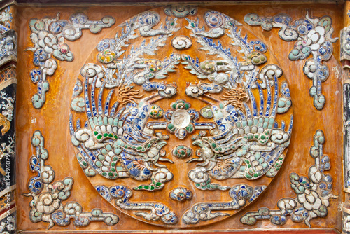Detail Of Ceramic Mosaic Twin Phoenix On The Wall Of A Palace In Hue Imperial Citadel, Vietnam.