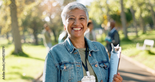 Charity, woman and portrait of volunteer with clipboard for waste checklist, inspection and community service. Female manager, park or nature for cleaning, nonprofit project and welfare with smile