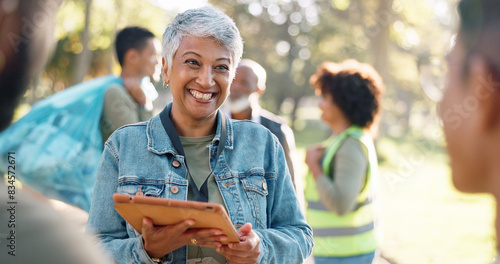 Park, woman and smile planning with tablet for volunteers, community project or nature sustainability. Humanitarian, recycling or senior leader in charity service or NGO for pollution cleanup