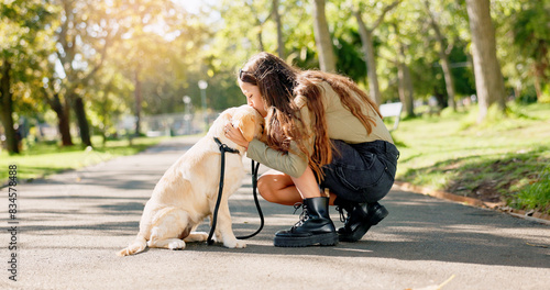Park, kiss and woman with dog in nature for walking, playing and training outdoors together. Friendship, animal rescue and happy person with pet Labrador for behavior, bonding and fun together