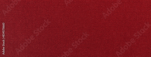 Cuadro en lienzo Dark red background from textile material with wicker pattern and texture, macro
