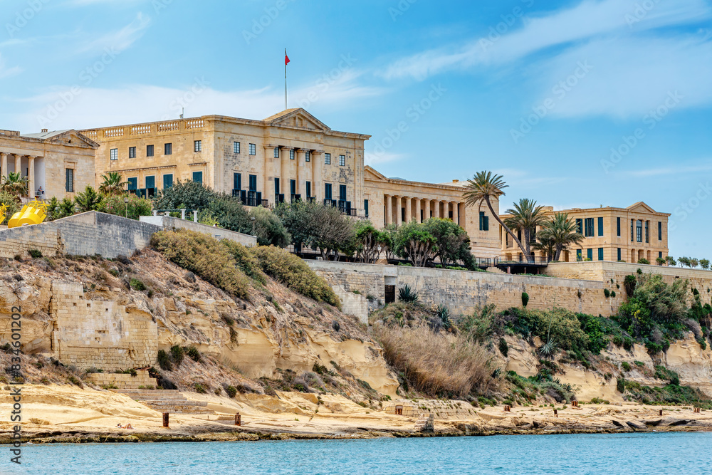 The historic Bighi Complex in Kalkara, Malta, featuring imposing architecture and coastal views along Triq Marina. Cultural heritage of Malta The historic Bighi Complex in Kalkara, Malta, featuring imposing architecture and coastal views along Triq Marina. Cultural heritage of Malta