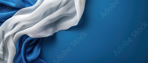 Unleash your creativity on a blank mockup exuding professionalism, accented by a seamless blend of blue and white fabric.