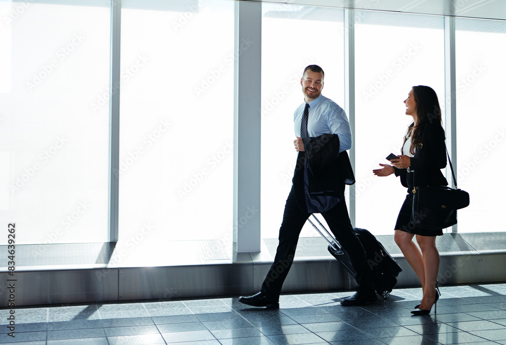 Fototapeta premium Walking, airport and business people with conversation, travel and talking with journey. Professional, corporate and employees with teamwork, legal aid and attorney with discussion, idea or luggage